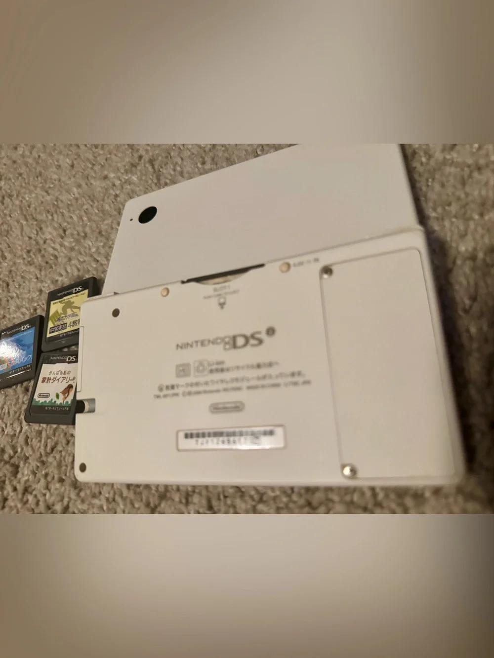 Nintendo DSI White Dual-Screen Handheld with 4 DS Game Cartridges - Japanese